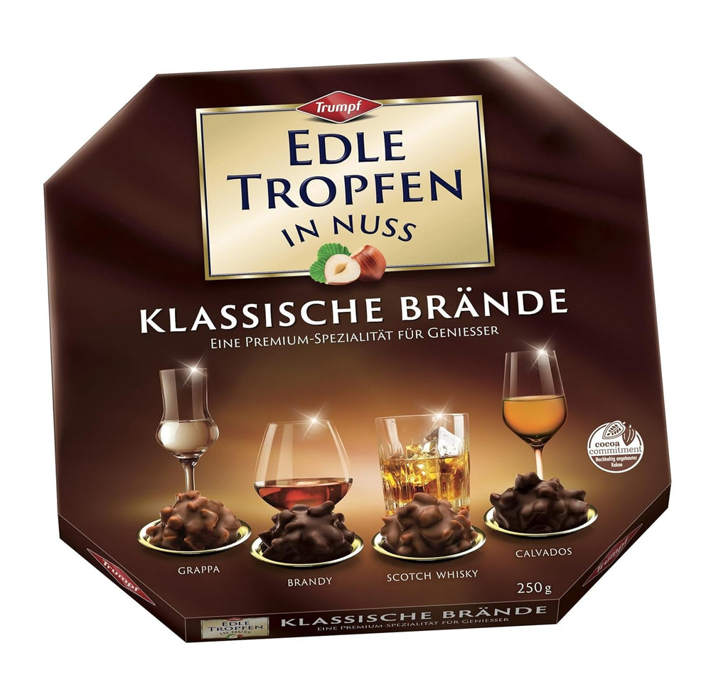 Picături fine în nuci clasice Brandies 250g, praline de ciocolată umplute cu lichid, cu glazură de ciocolată cu lapte și bucăți crocante de alune de pădure