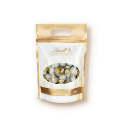 Czekoladowe kulki Lindt Marc de Champagne | 700 g Ok. 56 cukierków z mlecznej czekolady z rafinowanym nadzieniem, zawiera alkohol | Opakowanie zbiorcze | Prezent czekoladowy | Czekoladowy prezent