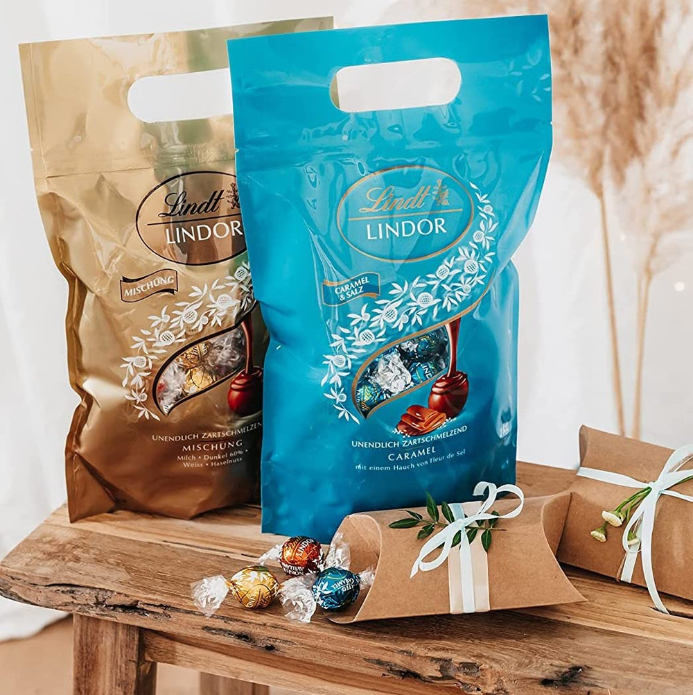 Kulki czekoladowe LINDOR | 1 kg zamykana torebka | ok. 80 kulek z mlecznej czekolady z nadzieniem miętowym | Opakowanie zbiorcze i kulki czekoladowe LINDOR Solony Karmel