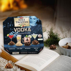 Edle Tropfen w Nuss Vodka Lounge 100g, pralinki czekoladowe nadziewane płynem z polewą z mlecznej czekolady i chrupiącymi kawałkami orzechów laskowych