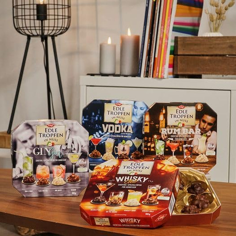 Edle Tropfen w Nuss Vodka Lounge 100g, pralinki czekoladowe nadziewane płynem z polewą z mlecznej czekolady i chrupiącymi kawałkami orzechów laskowych