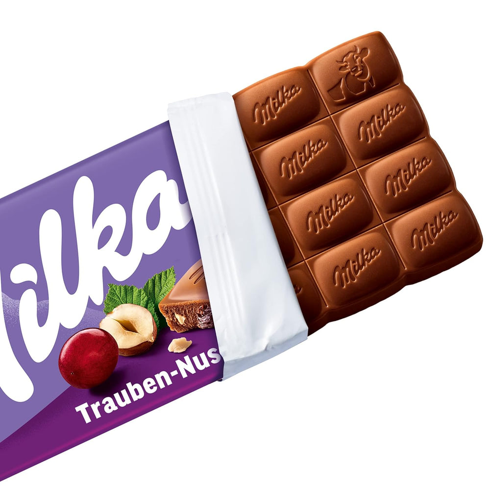 Milka Winogrona i Orzechy Laskowe – Alpejska czekolada mleczna z kawałkami orzechów laskowych i rodzynkami – 90g