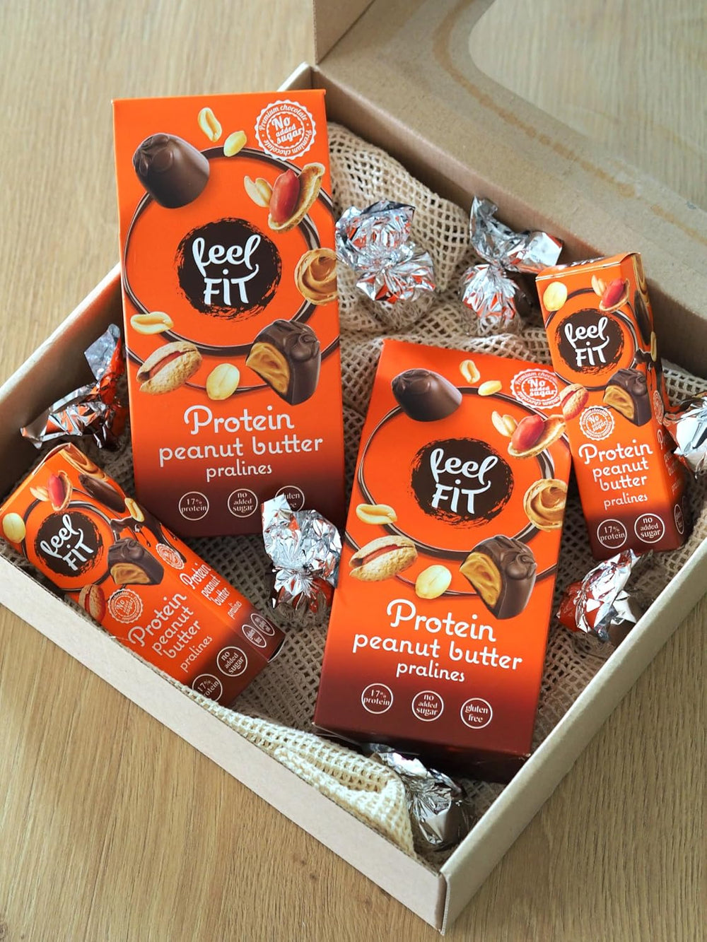 Feel FIT Praliny proteinowe z masłem orzechowym w wysokiej jakości mlecznej czekoladzie, bez dodatku cukru, 17% białka, bezglutenowe 66g (1 opakowanie)