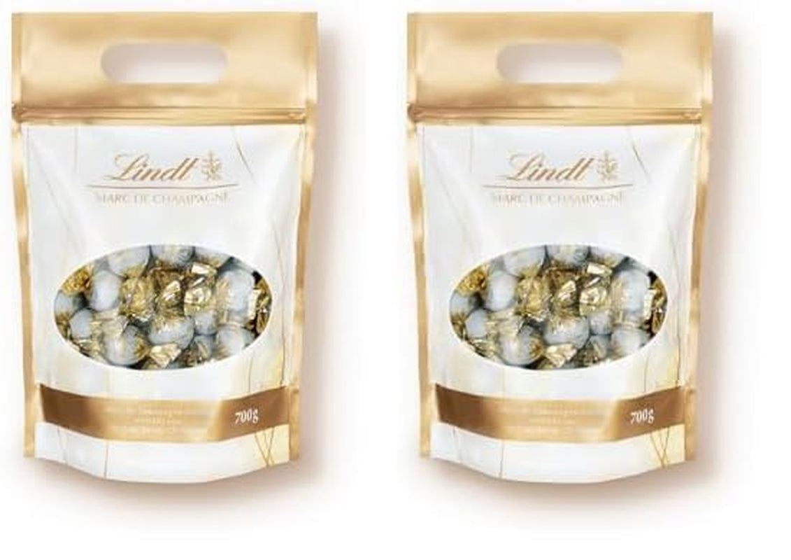 Czekoladowe kulki Lindt Marc de Champagne | 700 g Ok. 56 cukierków z mlecznej czekolady z rafinowanym nadzieniem, zawiera alkohol | Opakowanie zbiorcze | Prezent czekoladowy | Czekoladowy prezent