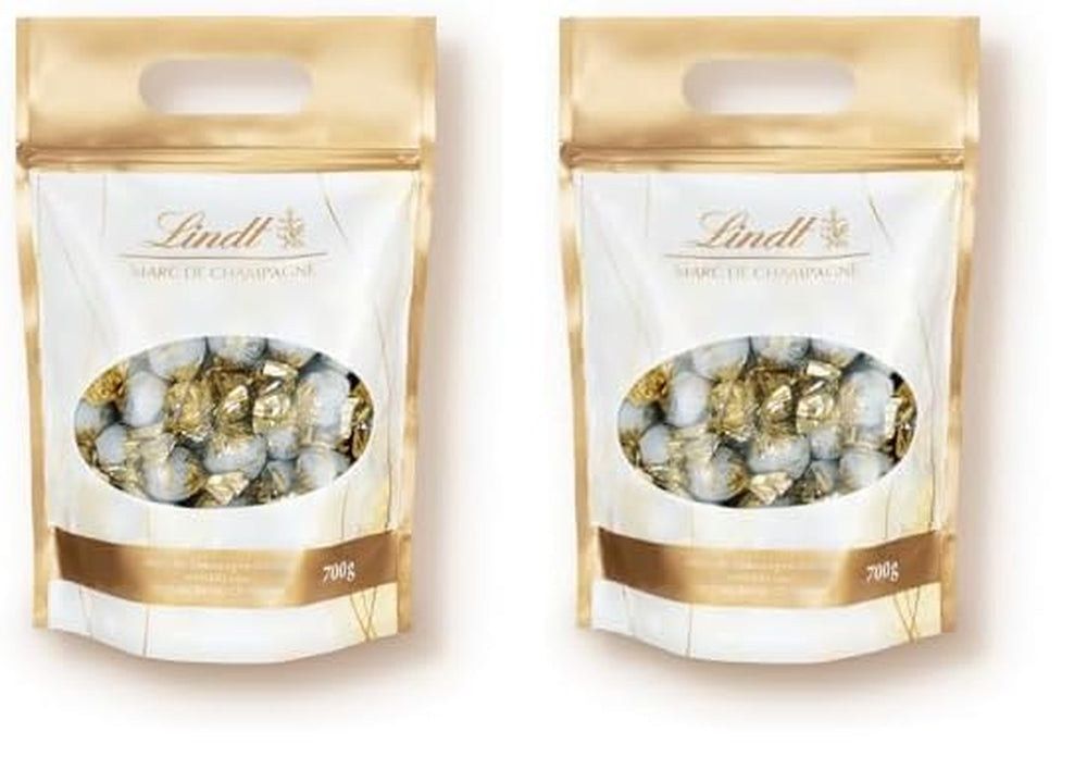 Czekoladowe kulki Lindt Marc de Champagne | 700 g Ok. 56 cukierków z mlecznej czekolady z rafinowanym nadzieniem, zawiera alkohol | Opakowanie zbiorcze | Prezent czekoladowy | Czekoladowy prezent