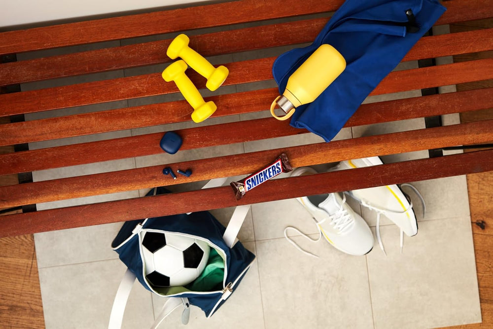 Duże opakowanie czekolady zawierające 32 tabliczki czekolady po 50 g każda.