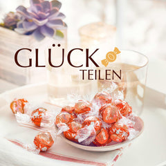 Lindt LINDOR Czerwone Pomarańczowe Kulki Czekoladowe | 1 kg zamykana torebka | ok. 80 cukierków czekoladowych z rozpływającym się w ustach nadzieniem | Opakowanie zbiorcze, prezent czekoladowy