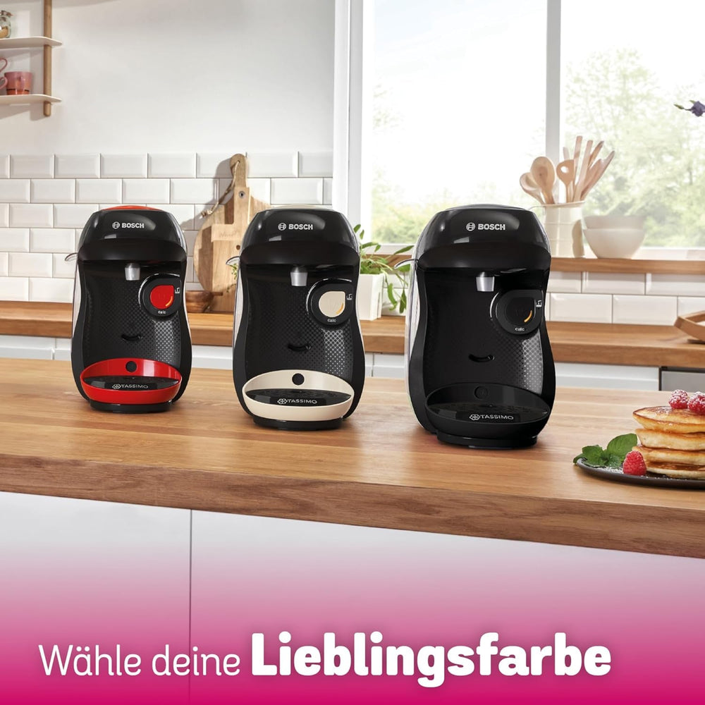 Espressor cu capsule Bosch Tassimo Happy Friendly TAS107E, peste 70 de băuturi, potrivit pentru toate tipurile de cești, oprire automată, sustenabil, dozare perfectă, economie de spațiu, 1400 W, crem/negru