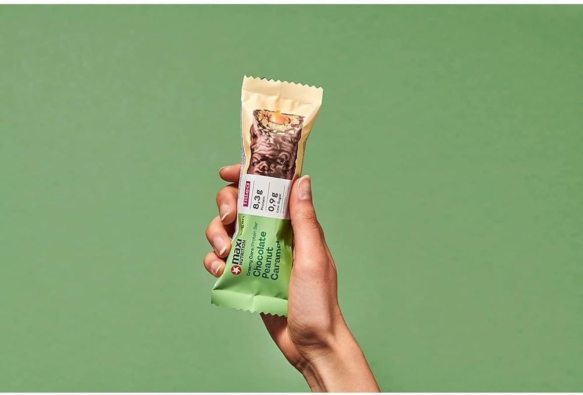 MaxiNutrition Kremowy wegański baton proteinowy z czekoladą, orzeszkami ziemnymi i karmelem 12x45g - wegański baton proteinowy, 18% białka, 8,3g w batonie, niska zawartość cukru (0,9g), bez dodatku cukru, bez sztucznych aromatów