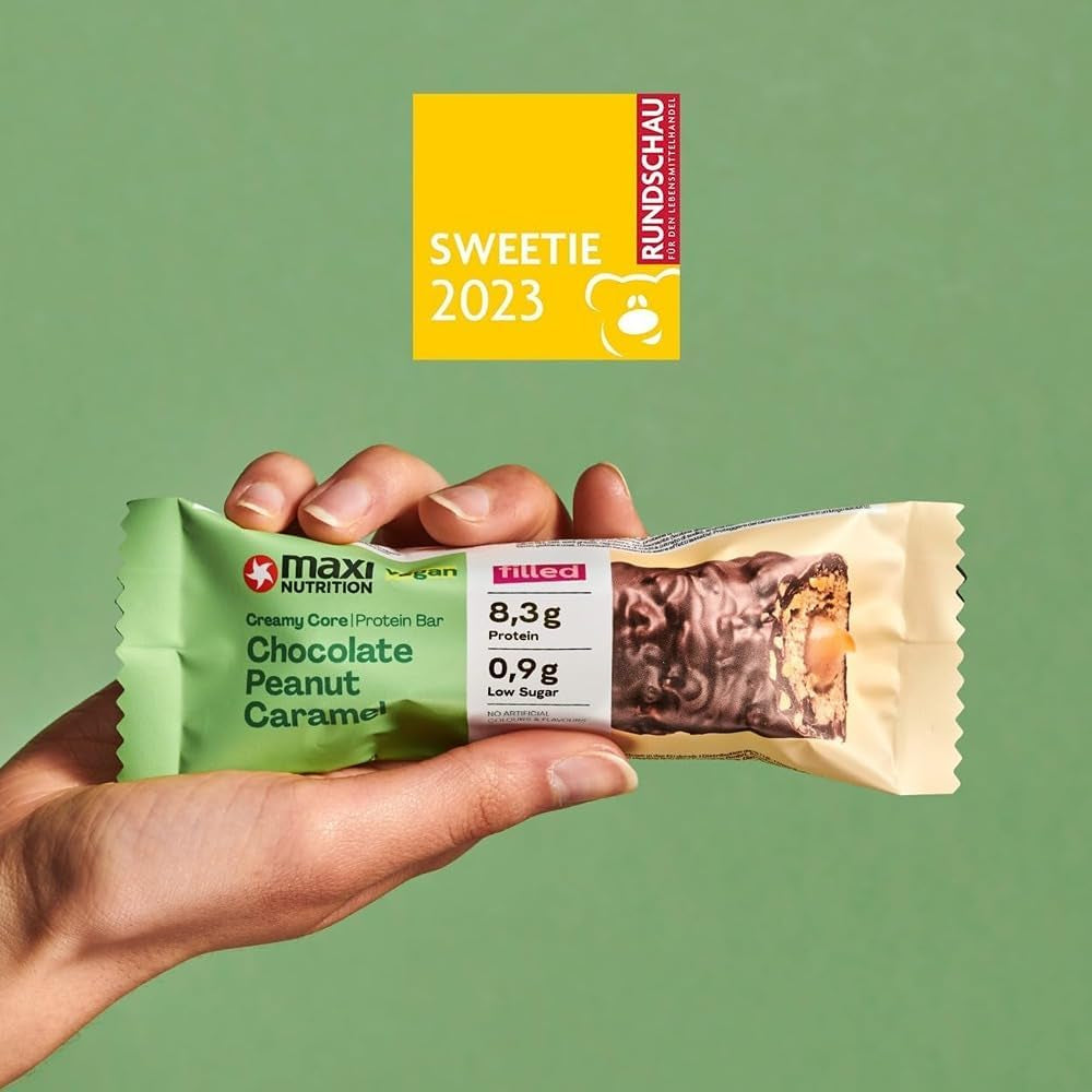 MaxiNutrition Kremowy wegański baton proteinowy z czekoladą, orzeszkami ziemnymi i karmelem 12x45g - wegański baton proteinowy, 18% białka, 8,3g w batonie, niska zawartość cukru (0,9g), bez dodatku cukru, bez sztucznych aromatów